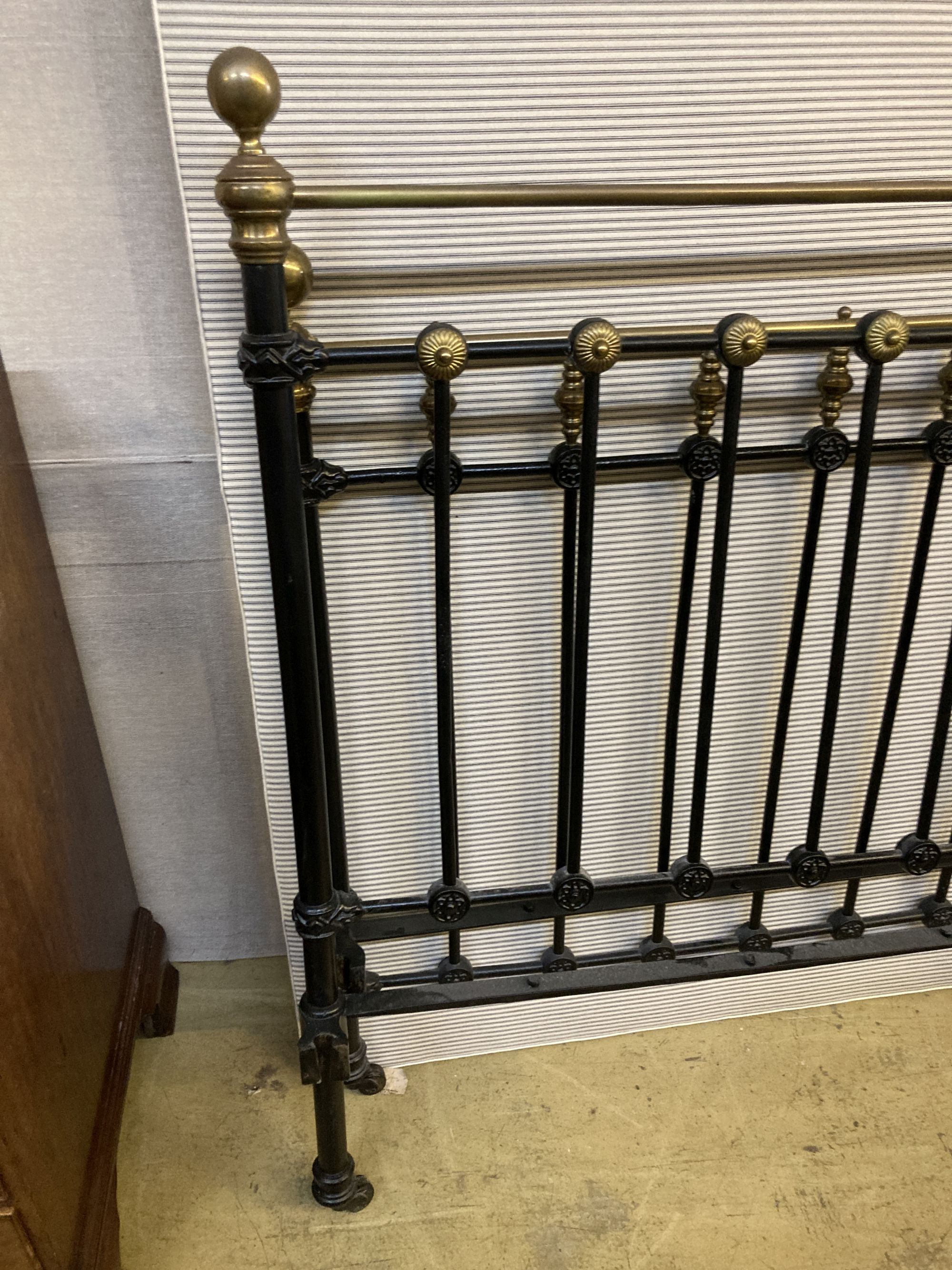 A Victorian style brass and iron double bed frame, width 4ft. 6in., height 140cm